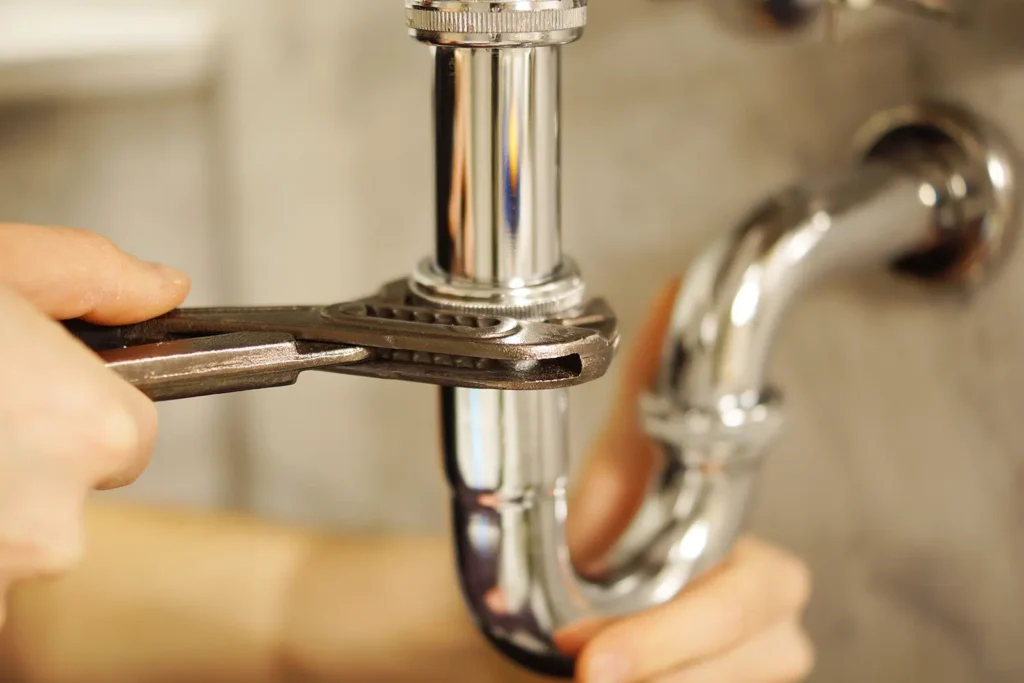 Under sink Burst Pipes on the gold Coast being repaired by a professional plumber - High Tide Plumbing & Gas
