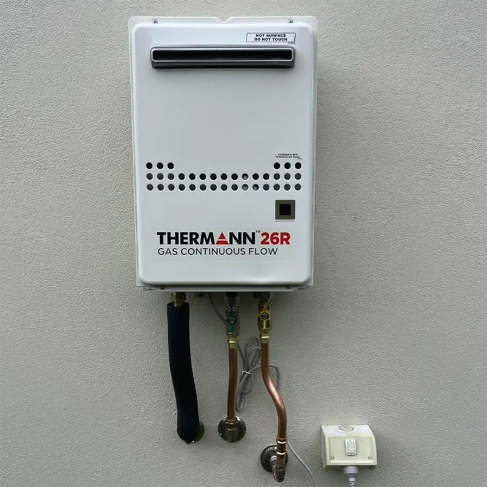 Gas Flow Control System mounted to an external house wall. High Tide Plumbing & Gas