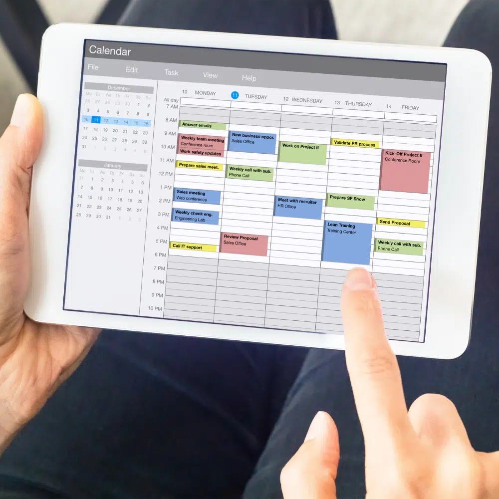 A Gold Coast homeowner scheduling tap maintenance service on an ipad.