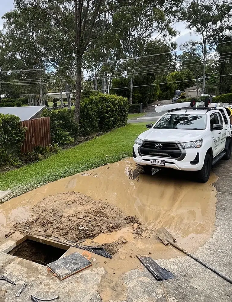 Burst Pipe Repairs on the Gold Coast at a hinterland property where the driveway is dug up by High Tide Plumbing & Gas