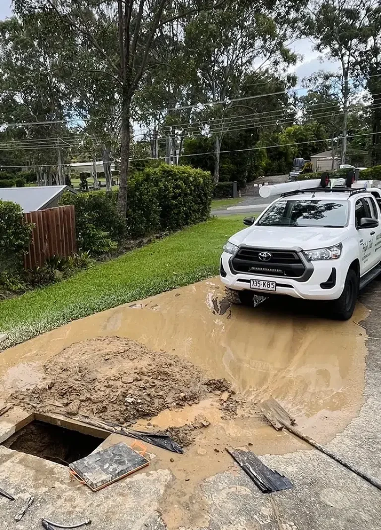 Burst Pipe Repairs on the Gold Coast at a hinterland property where the driveway is dug up by High Tide Plumbing & Gas